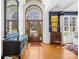 Elegant foyer featuring hardwood floors, a large arched doorway, and decorative furniture with natural lighting at 19118 Betty Stough Rd, Cornelius, NC 28031