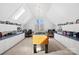 Bright game room with skylights, foosball table, and built-in storage at 19118 Betty Stough Rd, Cornelius, NC 28031