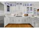 Bright kitchen showcasing white cabinets, modern appliances, and hardwood floors, ideal for cooking and entertaining at 19118 Betty Stough Rd, Cornelius, NC 28031