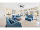Comfortable living room featuring a ceiling fan and access to the outdoors at 19118 Betty Stough Rd, Cornelius, NC 28031