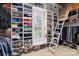 Well-organized walk-in closet with custom shelving, ladder, and a window at 19118 Betty Stough Rd, Cornelius, NC 28031