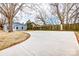 Expansive backyard featuring a large concrete patio and new fence for enhanced outdoor living and privacy at 2313 N Main St, Kannapolis, NC 28081