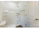 Clean bathroom featuring an all-white shower and tub, as well as a hardwood floor at 2313 N Main St, Kannapolis, NC 28081