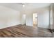 Spacious bedroom featuring wood-look floors, neutral paint, and ample natural light at 2313 N Main St, Kannapolis, NC 28081