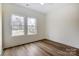 Bright bedroom with hardwood floors and two windows at 2313 N Main St, Kannapolis, NC 28081