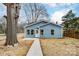 Charming blue home with ample front yard at 2313 N Main St, Kannapolis, NC 28081