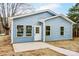 Inviting blue home with new windows, a white front door, and fresh concrete path creating instant curb appeal at 2313 N Main St, Kannapolis, NC 28081