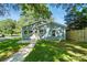 Charming blue home with a welcoming walkway and green grass at 2313 N Main St, Kannapolis, NC 28081