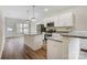 Stylish kitchen with stainless steel appliances, granite countertops, an island and sleek white cabinetry at 2313 N Main St, Kannapolis, NC 28081