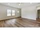 Bright living room featuring natural light, wood floors, and a view of the entryway at 2313 N Main St, Kannapolis, NC 28081