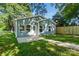 Rear exterior view of blue home with walkway and green grass at 2313 N Main St, Kannapolis, NC 28081