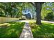 Long driveway with new wooden fence in the big, green yard at 2313 N Main St, Kannapolis, NC 28081