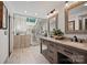 The bathroom offers a skylight, a glass shower, and double sinks at 27056 Catamaran Dr, Tega Cay, SC 29708