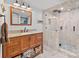 Bathroom with tile flooring, a granite vanity, and glass enclosed shower at 27056 Catamaran Dr, Tega Cay, SC 29708
