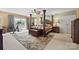 Large main bedroom with a ceiling fan and an area for workout equipment near a sliding glass door at 27056 Catamaran Dr, Tega Cay, SC 29708