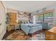 Coastal bedroom featuring beachy decor, a quaint bed, and natural light from the window at 27056 Catamaran Dr, Tega Cay, SC 29708