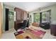 Bedroom featuring a wall bed, desk, area rug, and natural light at 27056 Catamaran Dr, Tega Cay, SC 29708