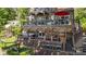 Multi-level deck with hot tub, outdoor bar, seating, and grill provides the ultimate space for relaxation and entertainment at 27056 Catamaran Dr, Tega Cay, SC 29708