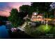 Beautiful property with a private dock and stairs leading up to the outdoor decks and home at 27056 Catamaran Dr, Tega Cay, SC 29708
