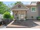 Inviting home entrance with glass door, neutral siding, and manicured landscaping for a welcoming first impression at 27056 Catamaran Dr, Tega Cay, SC 29708