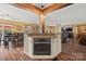 Bright kitchen with granite countertops, an island with a built-in oven, and wood flooring at 27056 Catamaran Dr, Tega Cay, SC 29708