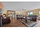 Open concept living room showcasing the kitchen and dining area, featuring hardwood floors at 27056 Catamaran Dr, Tega Cay, SC 29708