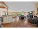Open floor plan connecting the kitchen and living room, with hardwood floors throughout at 27056 Catamaran Dr, Tega Cay, SC 29708