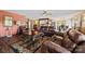 Comfortable living room with hardwood floors, plenty of seating, and lots of natural light at 27056 Catamaran Dr, Tega Cay, SC 29708