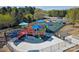 Community playground with colorful equipment, providing a fun and safe area for children to play at 27056 Catamaran Dr, Tega Cay, SC 29708