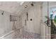 The shower offers stone pebble floors, wall-mounted shower head, and a bench at 27056 Catamaran Dr, Tega Cay, SC 29708