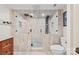 Glass enclosed shower with pebble tile floor, body jets and rain head at 27056 Catamaran Dr, Tega Cay, SC 29708