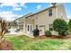 Exterior shot of backyard with a cozy patio, outdoor seating and well-manicured lawn at 3350 Keady Mill Loop, Kannapolis, NC 28081