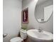 Chic powder room with toilet, decorative mirror, vanity, and stylish decor at 3350 Keady Mill Loop, Kannapolis, NC 28081