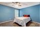 Cozy bedroom featuring blue walls, carpet, and natural light from the window at 3350 Keady Mill Loop, Kannapolis, NC 28081