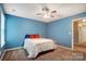 Bedroom with blue walls, carpet, a ceiling fan and a sunny window at 3350 Keady Mill Loop, Kannapolis, NC 28081