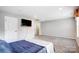Large bedroom area with overhead lighting, neutral walls, plush carpet and a mounted TV at 3350 Keady Mill Loop, Kannapolis, NC 28081
