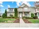 Charming two-story home featuring landscaped yard and a welcoming front porch during daytime at 3350 Keady Mill Loop, Kannapolis, NC 28081