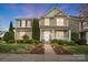 Charming two-story home featuring landscaped yard and a welcoming front porch at twilight at 3350 Keady Mill Loop, Kannapolis, NC 28081