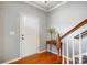 Bright foyer featuring hardwood floors, a staircase with white spindles and a wooden banister at 3350 Keady Mill Loop, Kannapolis, NC 28081