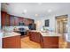 Modern kitchen featuring dark wood cabinets, granite countertops, and stainless steel appliances at 3350 Keady Mill Loop, Kannapolis, NC 28081