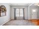 Neutral living room with carpet, natural light, and stylish curtains creates an inviting space at 3350 Keady Mill Loop, Kannapolis, NC 28081