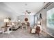 Spacious living room featuring neutral tones, comfortable seating, and a stylish ceiling fan at 3350 Keady Mill Loop, Kannapolis, NC 28081