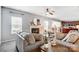 Inviting living room with comfortable sofas, a fireplace, and a seamless connection to the kitchen at 3350 Keady Mill Loop, Kannapolis, NC 28081