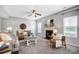 Cozy living room with a fireplace, neutral color palette, and large windows for natural light at 3350 Keady Mill Loop, Kannapolis, NC 28081