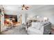 Open-concept living room flowing into a modern kitchen with hardwood floors and ample seating at 3350 Keady Mill Loop, Kannapolis, NC 28081