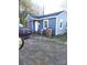Cozy single-story home featuring blue siding, a covered porch, and well-lit entrance at 336 Hudson St, Shelby, NC 28150