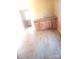 Spacious room with light wood look flooring and knotty pine cabinets at 336 Hudson St, Shelby, NC 28150