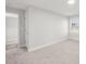 Neutral bedroom featuring carpeted floors, white trim, and an adjacent doorway at 407 E Talleyrand St, Monroe, NC 28112