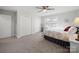 Spacious bedroom with carpet, ceiling fan, and ample closet space at 407 E Talleyrand St, Monroe, NC 28112