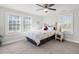 Cozy bedroom with natural light, ceiling fan, and neutral color scheme at 407 E Talleyrand St, Monroe, NC 28112